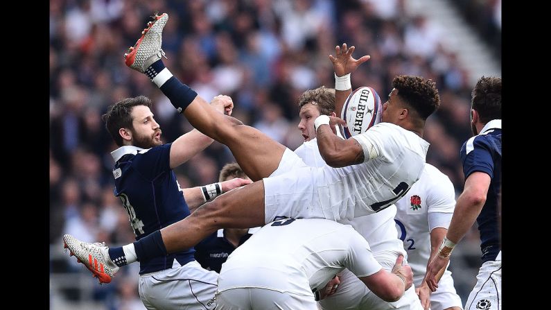 England's Anthony Watson catches the ball during a Six Nations match in London on Saturday, March 11. England smashed Scotland 61-21<a href="index.php?page=&url=http%3A%2F%2Fwww.cnn.com%2F2017%2F03%2F11%2Fsport%2Fsix-nations-england-scotland-new-zealand-world-record%2Findex.html" target="_blank"> to retain its Six Nations title.</a>