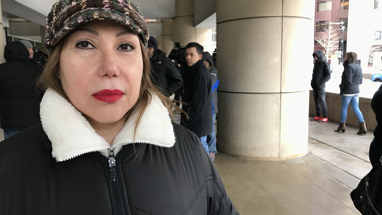 Esperanza Perez waits outside ICE for news about her son's case.