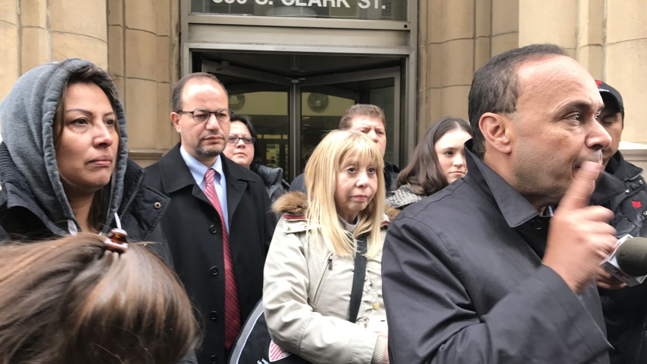 Francisca Lino listens to Rep. Gutierrez after sit-in wraps up.
