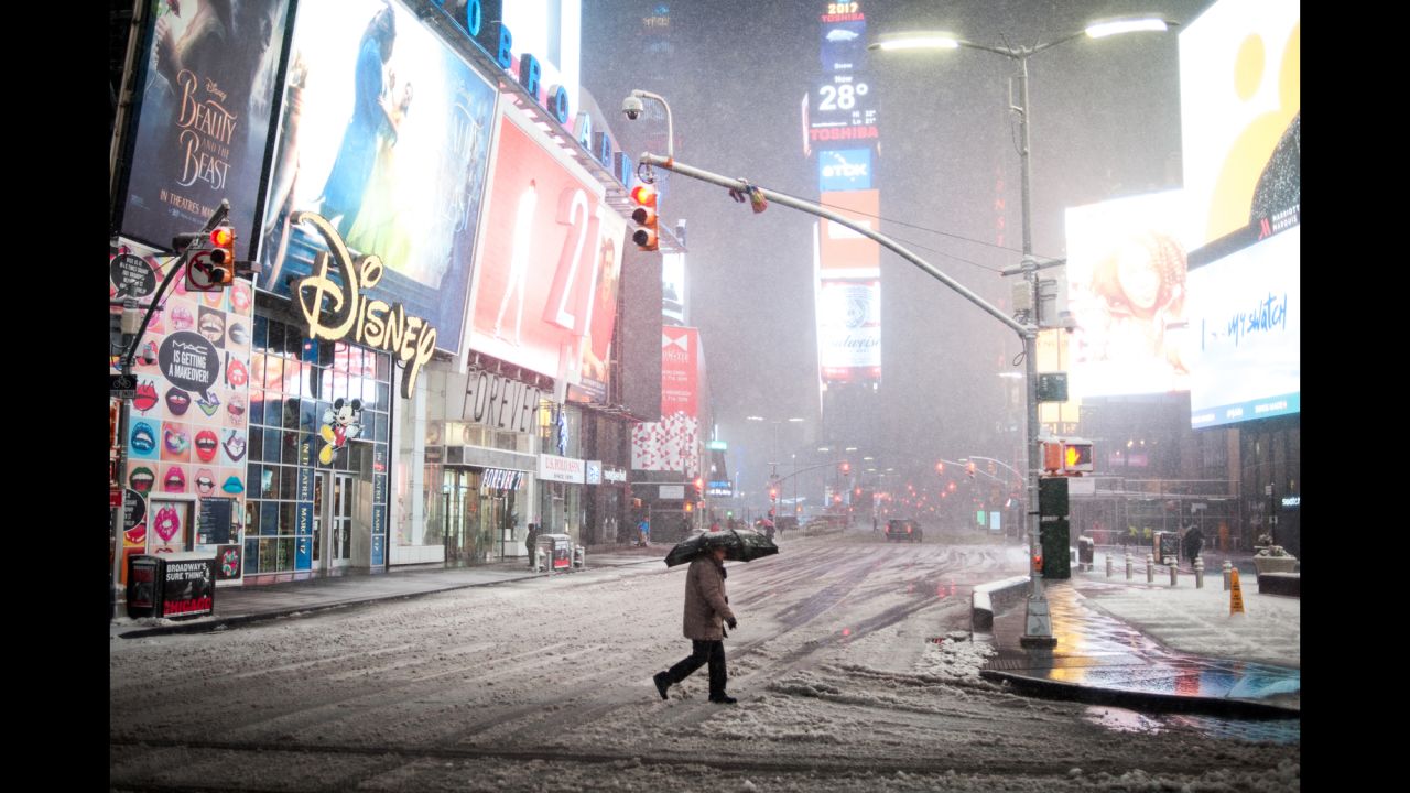 A person crosses the street in New York's Times Square on March 14.