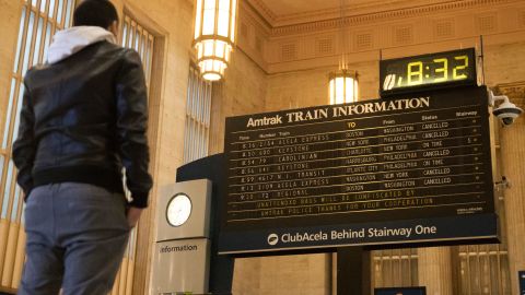 A man looks at train cancellations in Philadelphia on March 14.