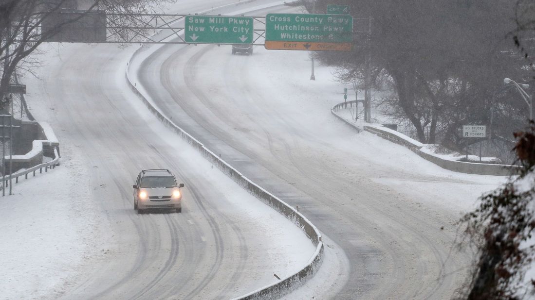 A vehicle makes its way through a normally busy intersection in Yonkers, New York, on March 14.