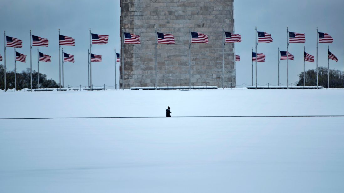 A person walks past the Washington Monument on March 14.