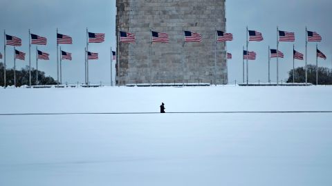 A person walks past the Washington Monument on March 14.