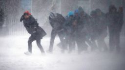 People struggle to walk in the blowing snow in Boston on March 14.
