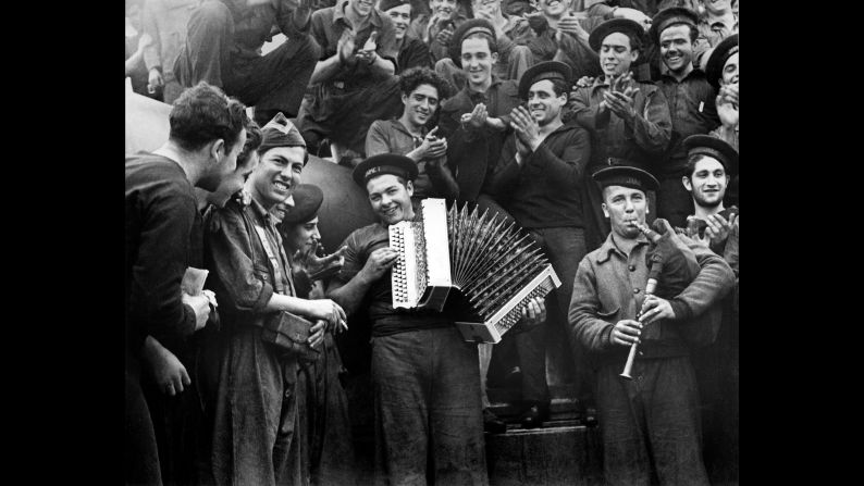 Spanish Marines play musical instruments on a battleship in February 1937.