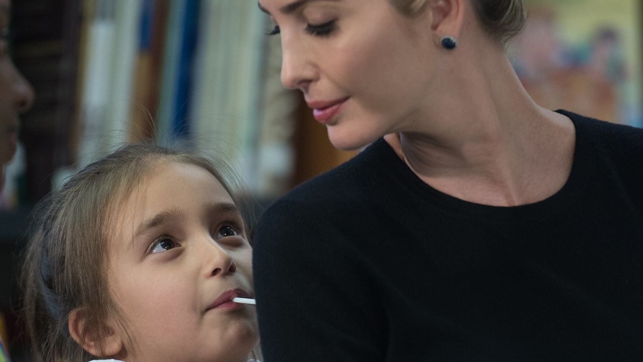 Ivanka Trump looks at her daughter Arabella as US President Donald Trump meets with parents and teachers at Saint Andrew Catholic School in Orlando, Florida, on March 3, 2017.
