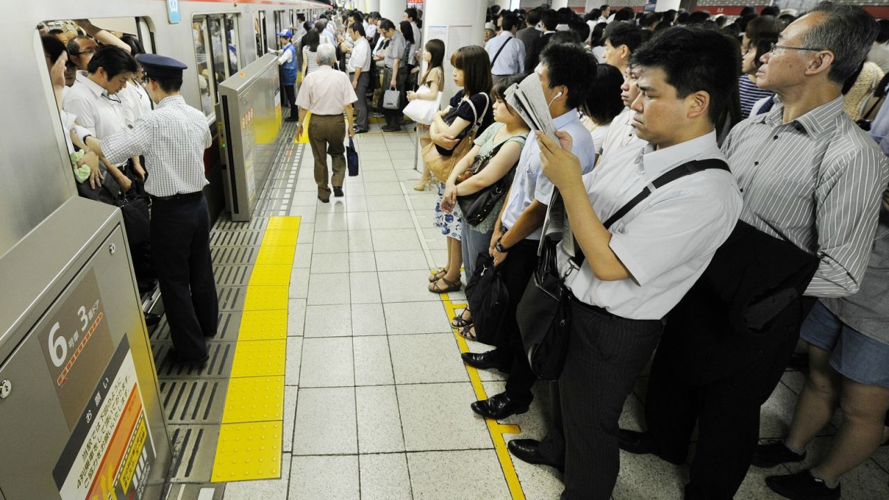 Polite and well-ordered chaos on Tokyo's subway.