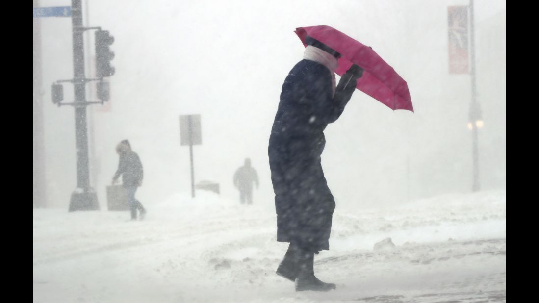 Cherie Burke contends with blowing snow in Portland, Maine, on March 14.