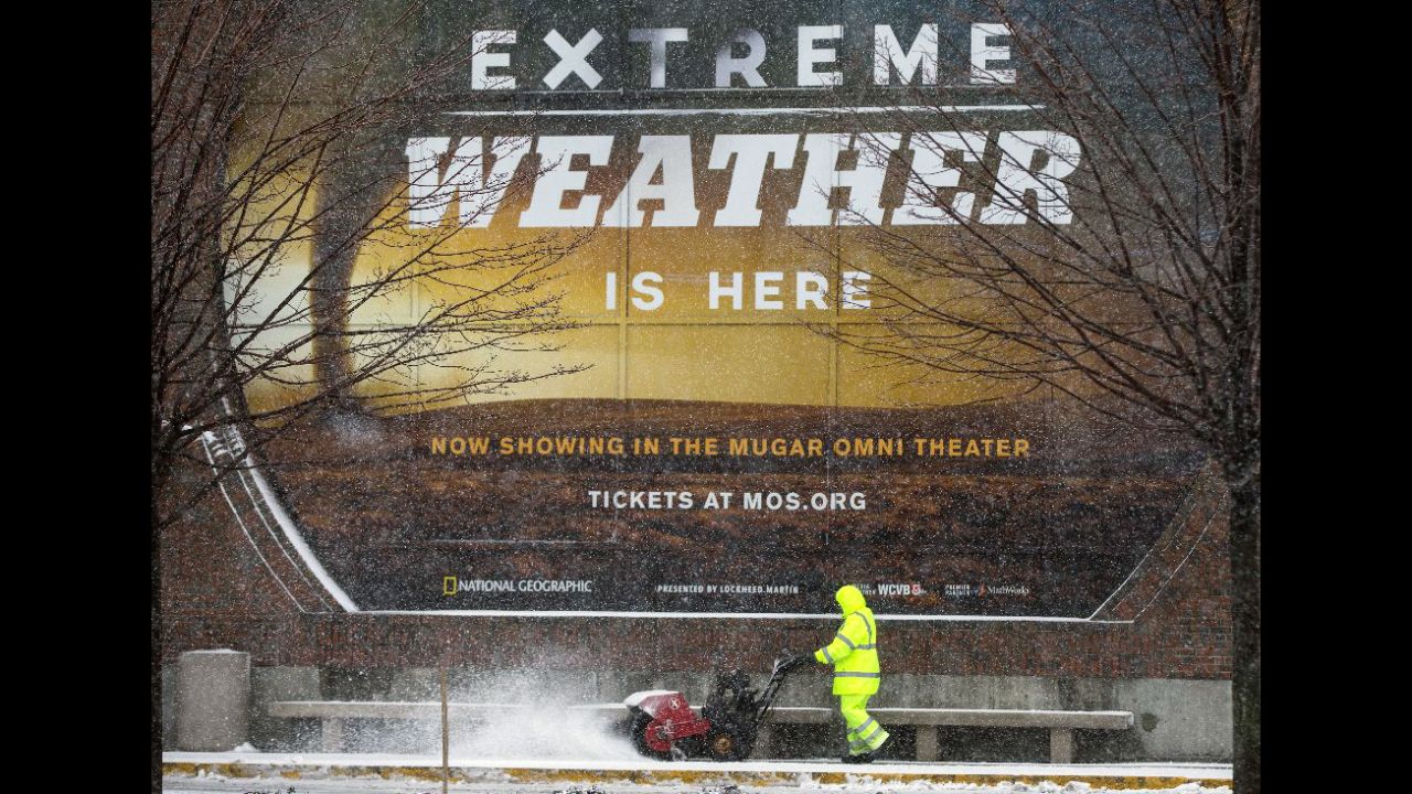 A worker clears the sidewalk in front of Boston's Museum of Science on March 14.