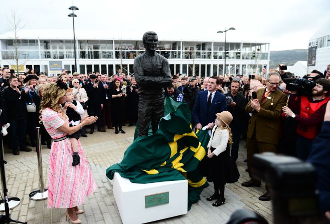 Legendary jockey A.P. McCoy, who has ridden 31 winners and won two Gold Cups at the Festival, unveils a statue of himself at the racecourse this year. 