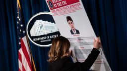 A staff member reveals a wanted poser of Igor Anatolyevich Sushchin, one of three Russians charged for in the 2014 hacking of Yahoo, during a press conference at the US Department of Justice on March 15, 2017 in Washington, DC.
Two agents of Russia's FSB spy agency and two "criminal hackers" were indicted Wednesday over a massive cyberattack affecting 500 million Yahoo users, the US Justice Department announced. The indictment unveiled in Washington links Russia's top spy agency to one of the largest cyberattacks in history, carried out in 2014, and which officials said was used for espionage and financial gain.
 / AFP PHOTO / Brendan Smialowski        (Photo credit should read BRENDAN SMIALOWSKI/AFP/Getty Images)