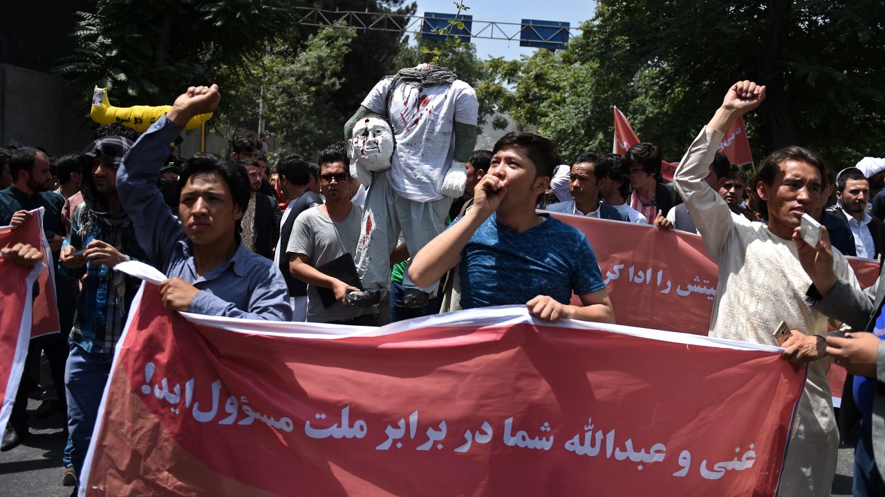 Protesters chant anti-government slogans as they march against the kidnapping of civilians by militants at Shar-e-Naw Park in Kabul in June 2016. 
