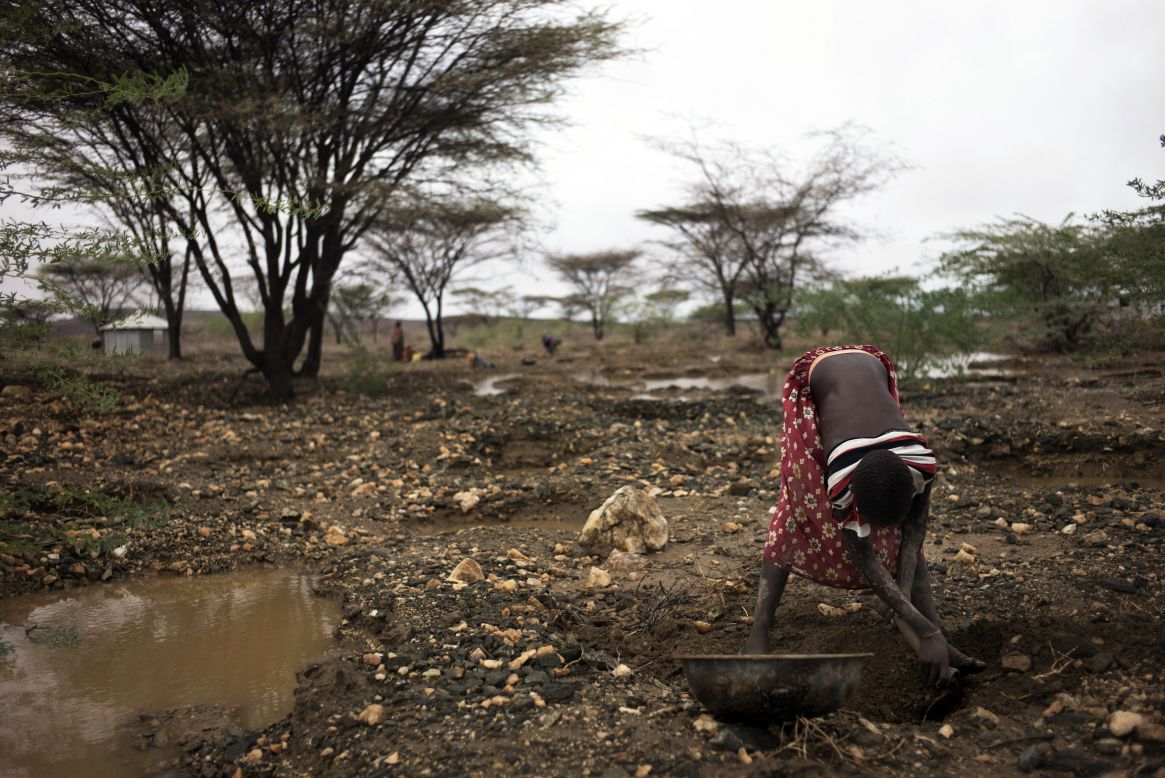 A member of the Turkana community of Lolupe, north of Lodwar in the Turkana region, searches for gold specks. A first downpour relieved pastoralists in the drought stricken Kenyan Turakana region after a twelve month span that pushed livestocks and communities to the brink of another looming humanitarian crisis.