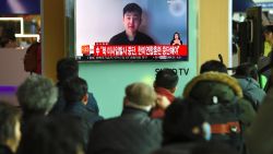 South Koreans watch a television news showing a video footage of a man who claims he is Kim Han-Sol, a nephew of North Korea's leader Kim Jong-Un, at a railway station in Seoul on March 8, 2017.
The video of a man describing himself as the son of assassinated North Korean exile Kim Jong-Nam emerged on March 8, apparently the first time a family member has spoken about the killing. / AFP PHOTO / JUNG Yeon-Je        (Photo credit should read JUNG YEON-JE/AFP/Getty Images)