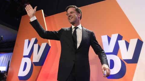 Netherlands' Prime Minister Mark Rutte celebrates after exit polls put him in first place.