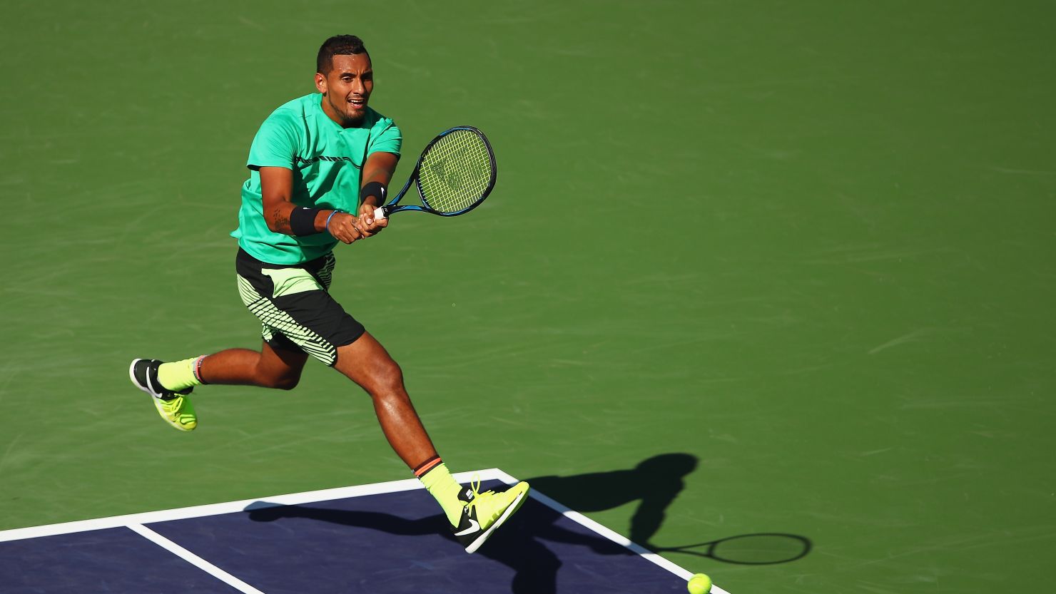 Nick Kyrgios plays a backhand during his fourth-round win over Novak Djokovic at Indian Wells.