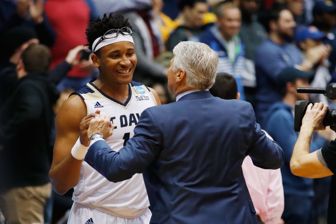 Moneke reacts with head coach Jim Les after defeating North Carolina Central.