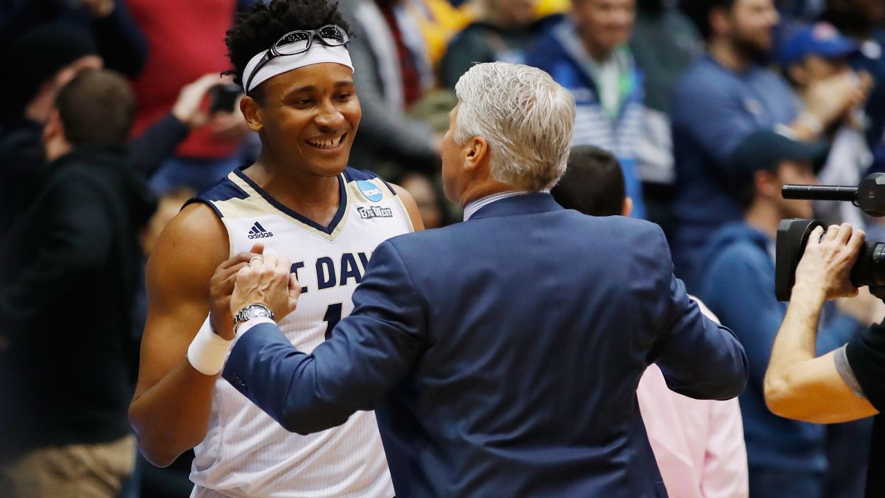 Moneke reacts with head coach Jim Les after defeating North Carolina Central.