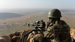 A Cameroonese soldier holds a position on Febuary 16, 2015 near the village of Mabass, northern Cameroon. Cameroon's army announced on February 17, 2014 having killed 86 Boko Haram militants and detained 1,000 people suspected of links to the Islamist group, as central African leaders held talks on how to combat its bloody insurgency.  Five Cameroonian soldiers were also killed during the clashes in the Waza region near the border with Nigeria, defence ministry spokesman said. AFP PHOTO REINNIER KAZE        (Photo credit should read Reinnier KAZE/AFP/Getty Images)