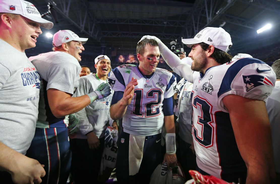 Nate Ebner (R) congratulates Tom Brady after the New England Patriots' 2015 Super Bowl win.  