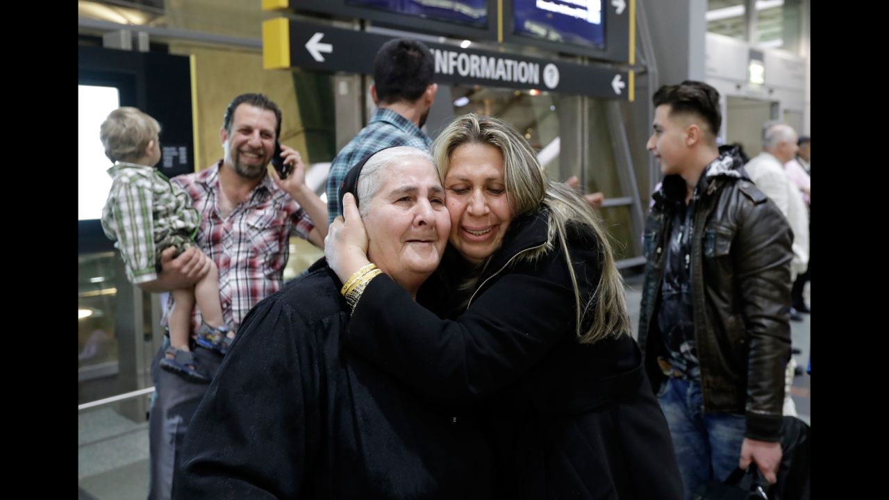 Nadia Hanan Madalo hugs her mother, Alyshooa Kannah, at an airport in San Diego on Wednesday, March 15. Madalo and her family are Iraqi refugees who were forced to flee the town of Batnaya after ISIS militants invaded several years ago.