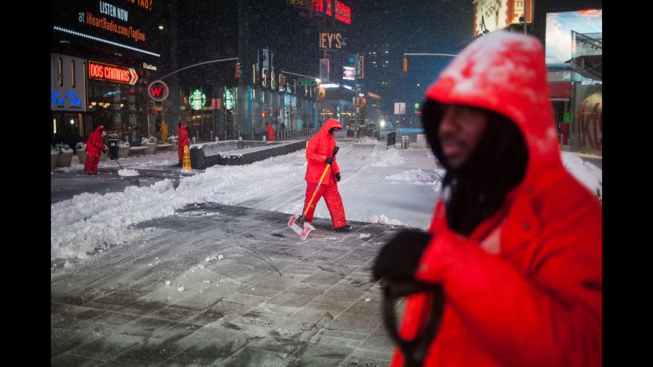 Workers clear snow in New York's Times Square on Tuesday, March 14. The city was spared the worst of <a href="http://www.cnn.com/2017/03/14/weather/gallery/northeast-winter-weather-0314/index.html" target="_blank">this week's nor'easter,</a> but it still got plenty of wet and heavy snow. <a href="http://www.cnn.com/2017/03/14/us/new-york-winter-storm-before-after-sliders/index.html" target="_blank">See New York before and after the storm</a>
