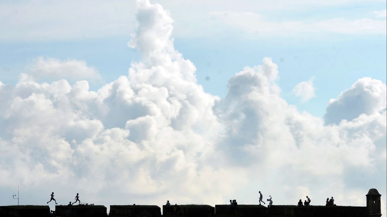 Tourists visit a 16th-century Dutch fort in Galle, Sri Lanka, on Friday, March 10.