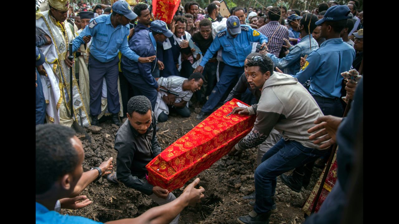 A coffin is buried outside a church in Addis Ababa, Ethiopia, on Monday, March 13. More than 100 people were killed after <a href="http://www.cnn.com/2017/03/15/africa/ethiopia-trash-landslide-death-toll/" target="_blank">a weekend landslide</a> at a massive landfill.
