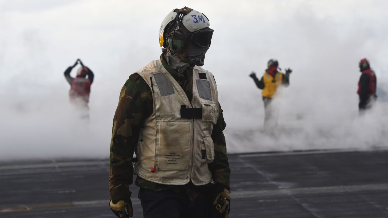 Sailors work on the deck of the USS Carl Vinson during a training exercise east of the Korean Peninsula on Tuesday, March 14. It was the annual Foal Eagle exercise with South Korea.