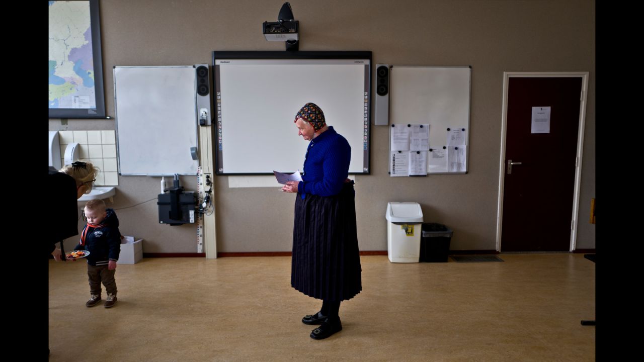 A woman waits to cast her vote at a school in Staphorst, Netherlands, on Wednesday, March 15. Dutch Prime Minister Mark Rutte staved off a challenge from his far-right rival in an election widely seen as an indicator of populist sentiment in Europe, <a href="http://www.cnn.com/2017/03/15/europe/netherlands-dutch-elections/" target="_blank">preliminary results indicated.</a>