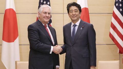 US Secretary of State Rex Tillerson (left) and Japanese Prime Minister Shinzo Abe (right) shake hands during their meeting at the Prime Minister's office in Tokyo on March 16, 2017.