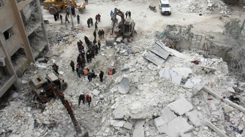 Rescuers search for victims after an air strike in the Syrian city of Idlib on March 15, 2017. Russia has propped up President Bashar al-Assad's with air power.