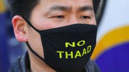 A South Korean protester wears a black mask reading "No THAAD" during a rally against the planned deployment of the US-built Terminal High Altitude Area Defense (THAAD) anti-ballistic missile system, outside the Defence Ministry in Seoul on February 28, 2017.
Residents living near a South Korean golf course on February 28 sued to stop it becoming the site of a controversial US missile system loathed by Beijing, their lawyers said as Chinese media poured scorn on the plan. / AFP / JUNG Yeon-Je        (Photo credit should read JUNG YEON-JE/AFP/Getty Images)
