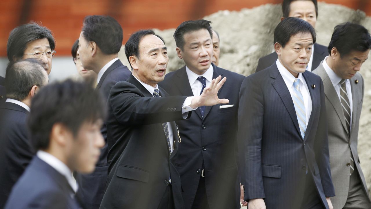 Yasunori Kagoike (center left), the head of Moritomo Gakuen.