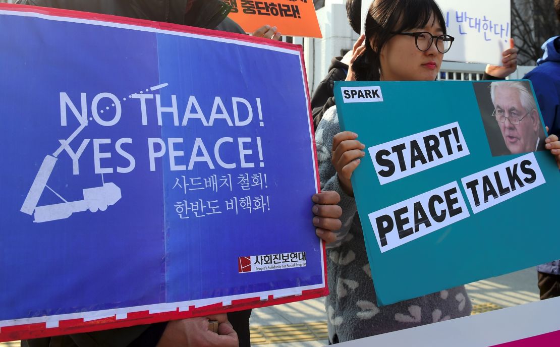 Anti-war activists protest Tillerson in Seoul.