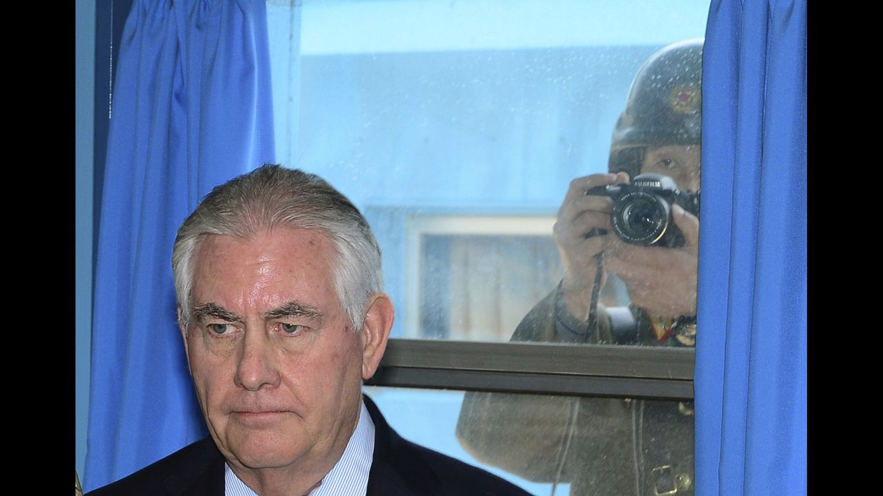 A North Korean soldier tries to take a photograph through a window as US Secretary of State Rex Tillerson visits a UN meeting room at the border village of Panmunjom on Friday, March 17. <a href="http://www.cnn.com/2017/03/17/politics/tillerson-south-korea-dmz/" target="_blank">Tillerson visited the world's most heavily armed border,</a> greeting US soldiers near the tense buffer zone between North and South Korea.