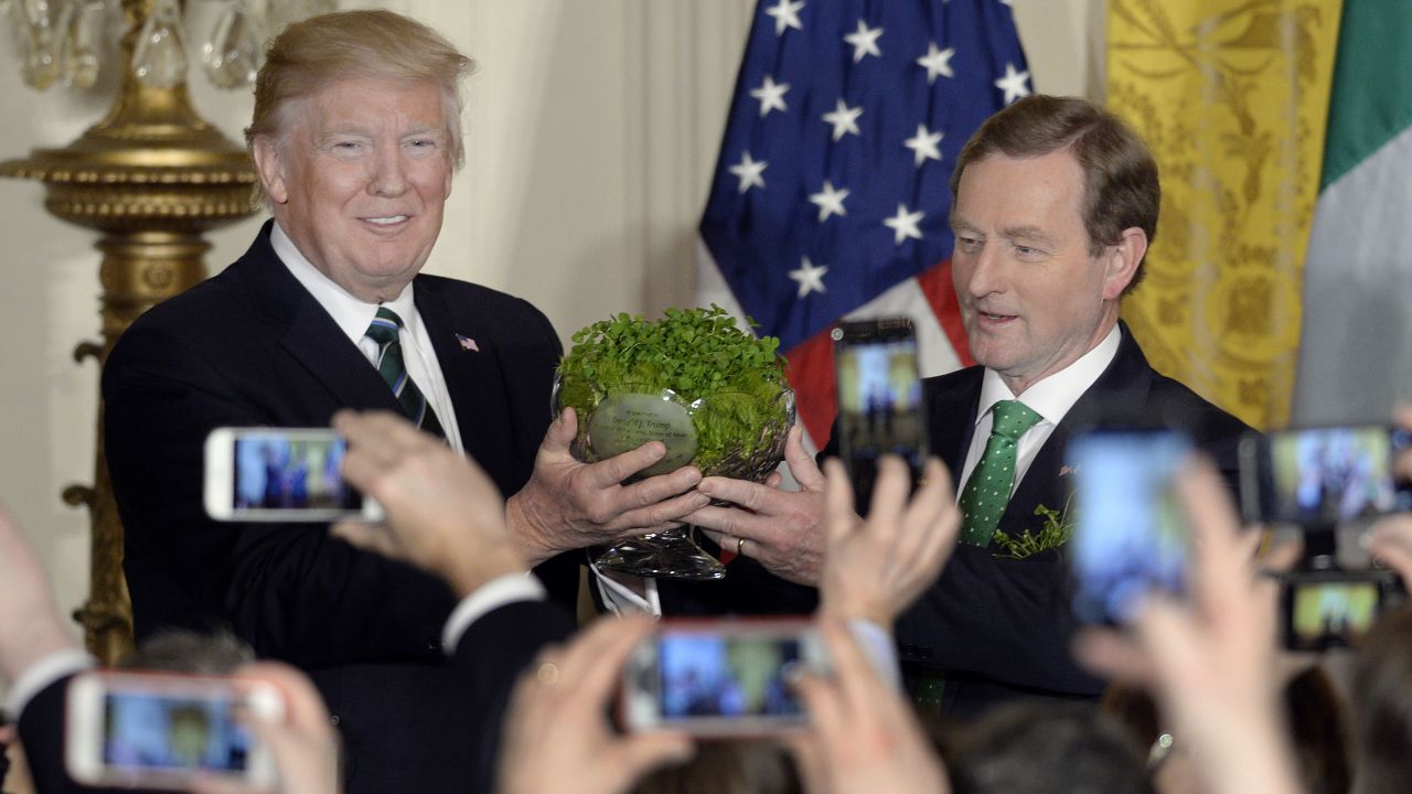 Trump accepts a bowl of shamrocks from Irish Prime Minister Enda Kenny on Thursday, March 16, a day before St. Patrick's Day.