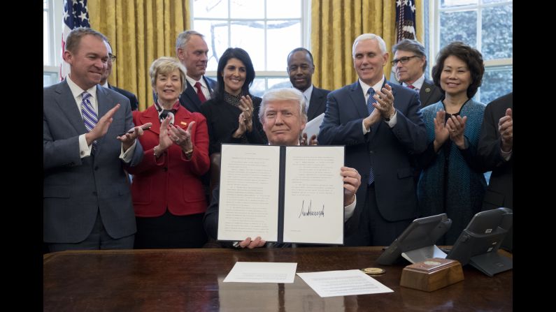 President Trump, joined by members of his Cabinet on Monday, March 13, shows an executive order <a href="http://www.cnn.com/2017/03/14/politics/donald-trump-dismember-government/" target="_blank">that mandates an evaluation of every executive agency</a> to see where money could be saved.