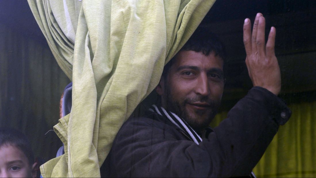 A Syrian man waits to leave the rebel-held Al-Waer neighborhood in of Homs.