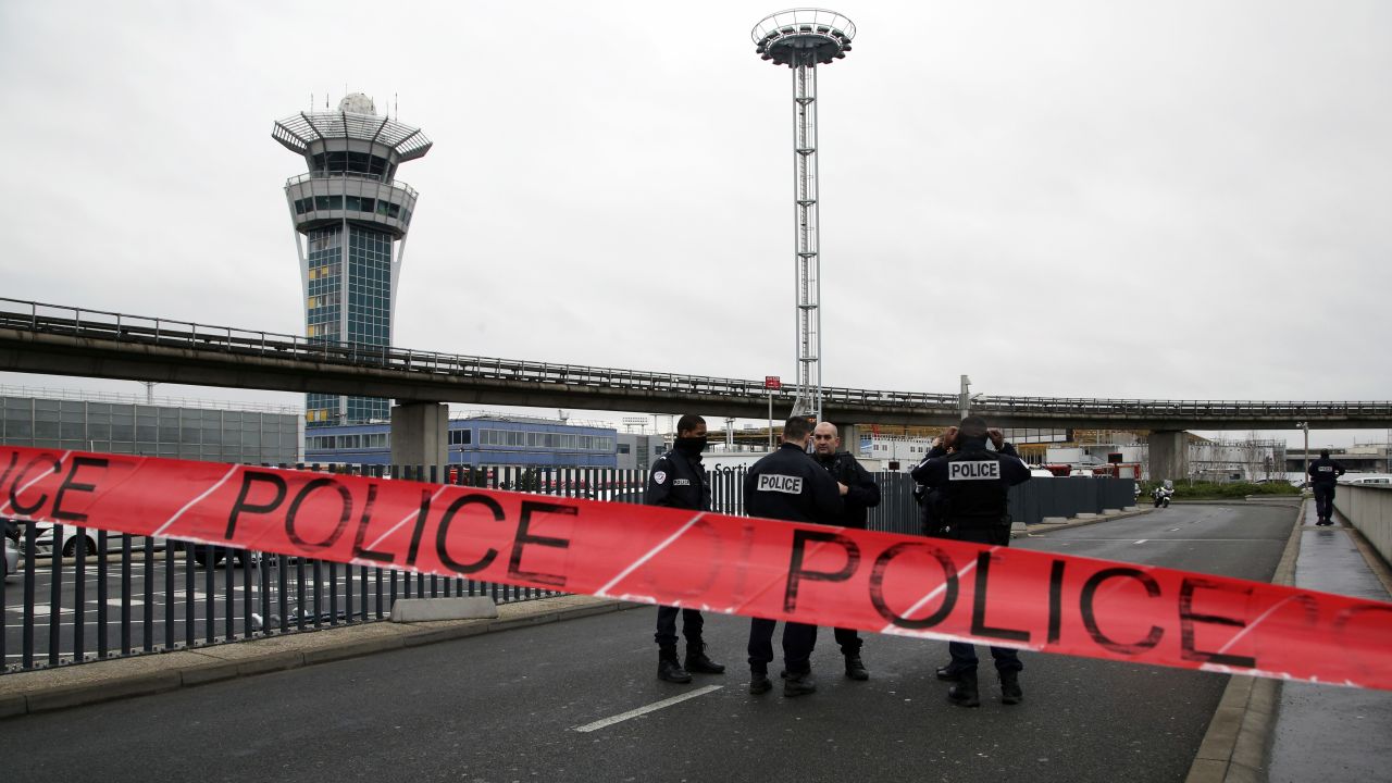 Police cordon off access to Paris Orly Airport after a man was shot and killed on Saturday, March, 18, after he tried to seize a soldier's weapon.
