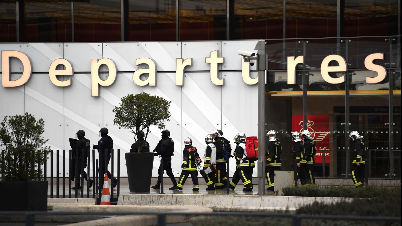French firefighters and RAID police unit officers secure Paris' Orly airport.