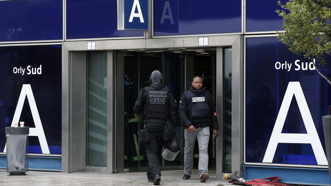 French elite police forces patrol the airport departure area.