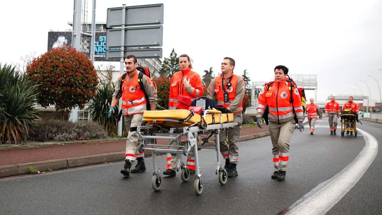 French Red Cross workers arrive at Paris' Orly airport.