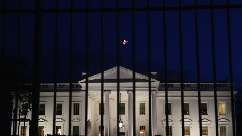 A tall security fence stands in front of the White House on this November 4, 2014 file photoin Washington, DC. Today