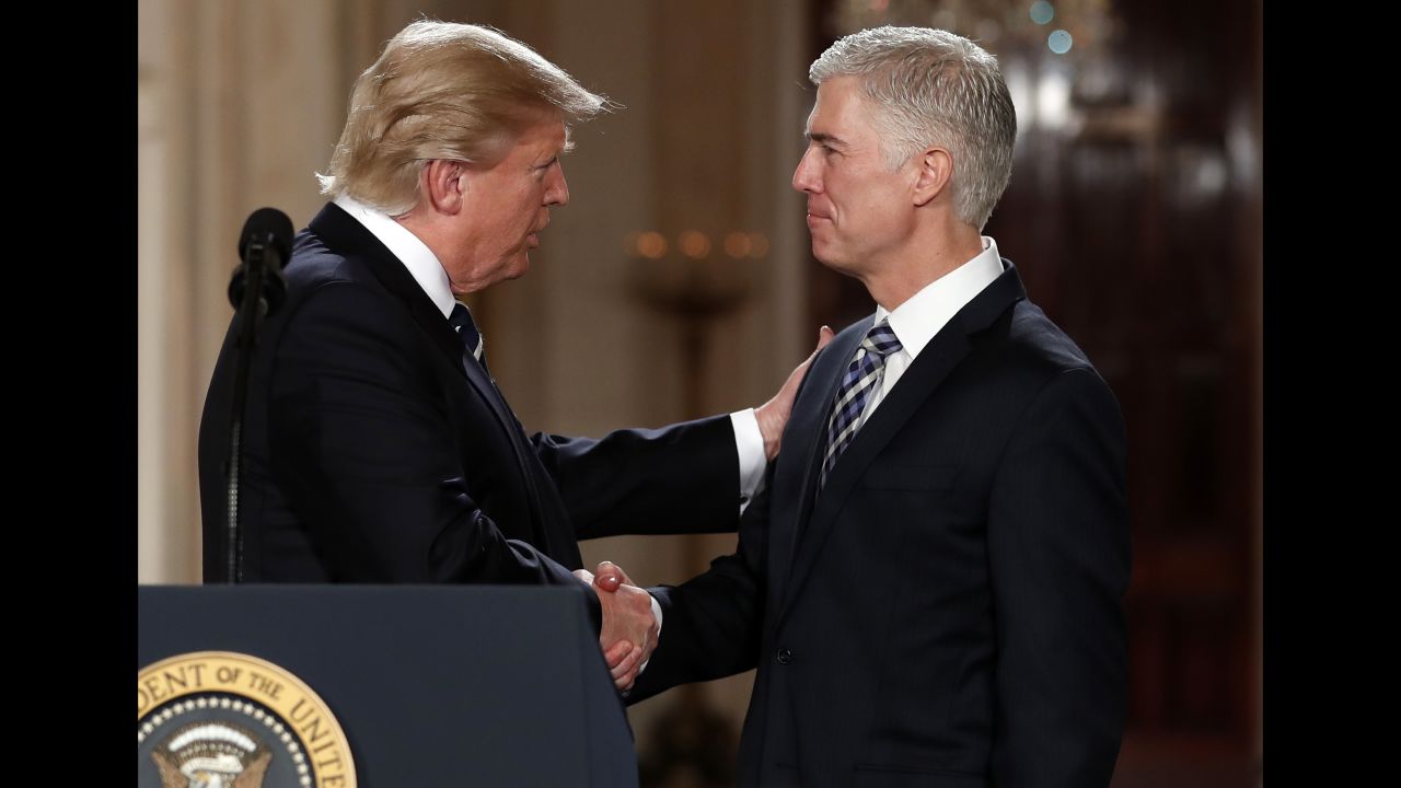 President Donald Trump shakes hands with Gorsuch in the East Room of the White House in January 2017.