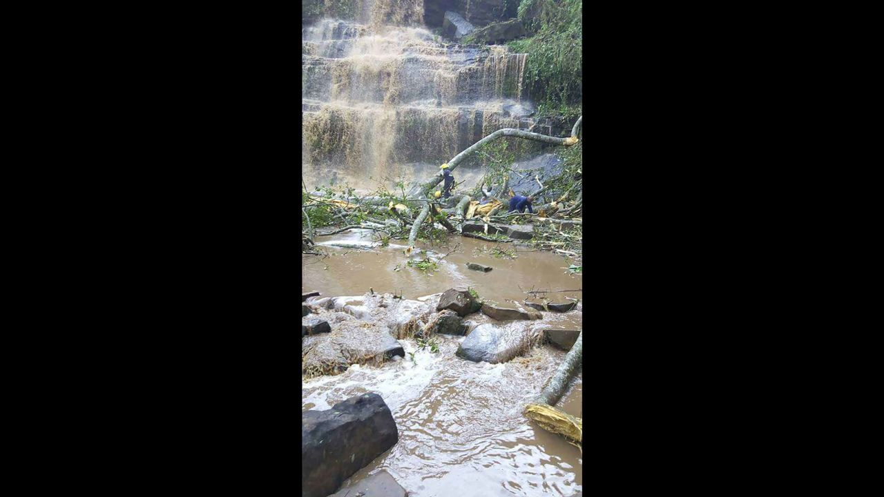 Rescuers search for survivors trapped underwater after a tree fell at Kintampo waterfall in Ghana on March 19, 2017. 