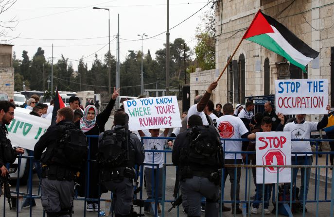 Police were on standby to contain protesters around the course. Some (pictured) were claiming part of the marathon was staged on occupied land, while there was also disruption from members of the Jewish Haredi community, who were thought to be <a href="index.php?page=&url=http%3A%2F%2Fforward.com%2Fnews%2Fbreaking-news%2F366328%2Fharedi-men-detained-allegedly-en-route-to-disrupt-jerusalem-marathon%2F" target="_blank" target="_blank">protesting against an increase in military service.  </a>