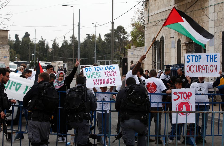 Police were on standby to contain protesters around the course. Some (pictured) were claiming part of the marathon was staged on occupied land, while there was also disruption from members of the Jewish Haredi community, who were thought to be <a href="http://forward.com/news/breaking-news/366328/haredi-men-detained-allegedly-en-route-to-disrupt-jerusalem-marathon/" target="_blank" target="_blank">protesting against an increase in military service.  </a>