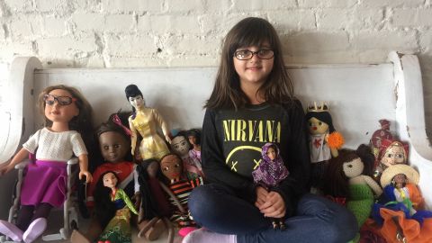 Grace, who is 5, with her dolls.